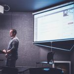 person-standing-in-front-of-brown-lectern-gyf49rb7bve